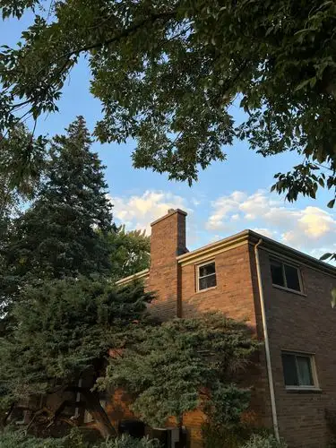 Golden hour glow on a cozy brick home.